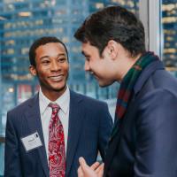 Saad Ahsan'21, Garrett Moore'20, and Beth Burnson'88 chat during Beloit's 2019 Econ Day in Chicago.